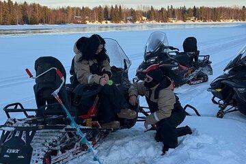 Snowmobiling Ice Fishing and Aurora Hunt