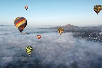 Hot Air Balloon Ride with Breakfast in Cave and Transportation