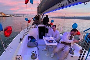 Sunset Sailboat Tour with Guide and Open Bar Green Wine In Lisbon