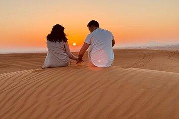 Dubai Evening Desert Adventure BBQ Camel Falcon pic and Sandboard
