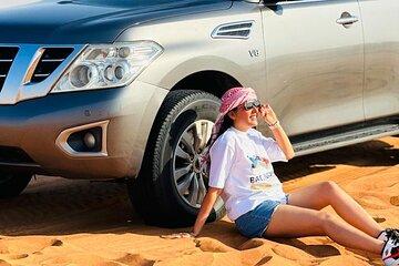 Abu Dhabi Dune Bashing, Sand Surfing, Camel Ride, and BBQ Dinner