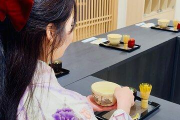 Tea and Calligraphy Session at a Table in Osaka