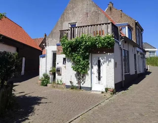 The cosy little house with the sundial