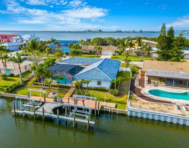 Casa De Olas - Waterfront Luxe Home - Heated Pool - Game Room - Boat Lift - Minutes to Beach