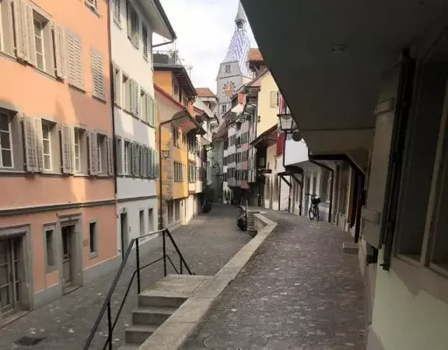 Bedroom cum office with shared shower in Zug's Old Town