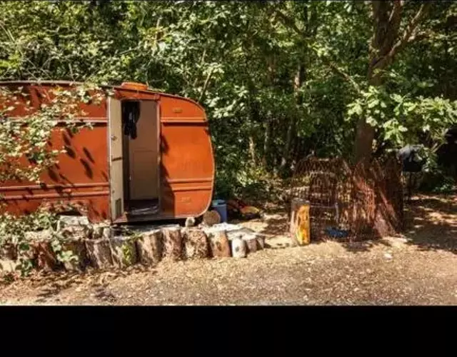 little vintage caravan with cosy log burner