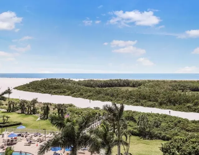 Beachfront condo with SW-facing balcony and pool