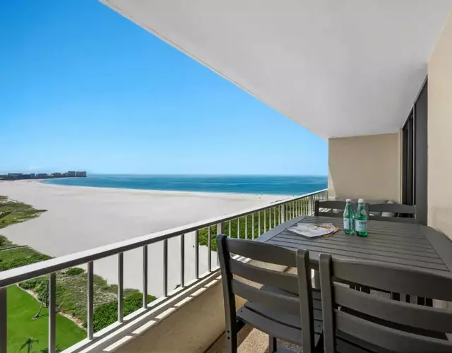 Penthouse beachfront condo with pool/fitness/grills