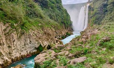 Tamul waterfall and water cave on a wooden canoe