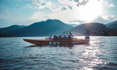 Wine tasting on traditional wooden boats in Wachau Valley