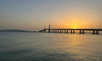 Sunset Cruise with Etihad Tower Views and Beach Walk