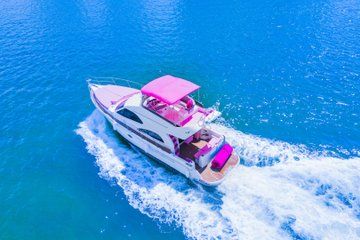 Luxury Pink Yacht Experience with 2 Jet Skis – Up to 13 Guests