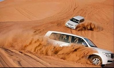 Red Dunes Sandboarding Quad Bikes and Camel Ride Adventure