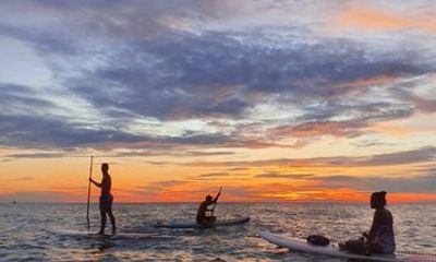 Venture over the Caribbean waters in a Paddleboarding class