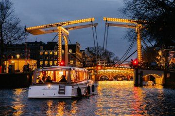 Explore Amsterdam's Canals Aboard a Cozy Small Group Cruise