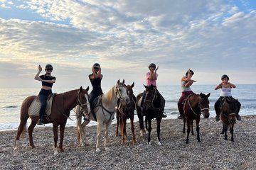 Horseback riding through the pine forest and along a natural beach