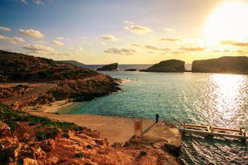 Sunset Comino Lagoons and Sea Caves Tour
