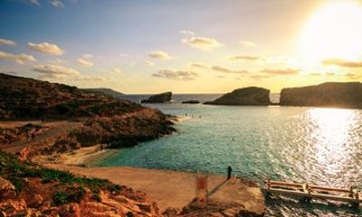 Sunset Comino Lagoons and Sea Caves Tour