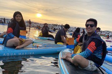 Paddle surfing experience at sunset