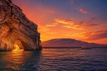 Zakynthos Sunset Boat Tour to Blue Caves, Swim Stops and Aperitif