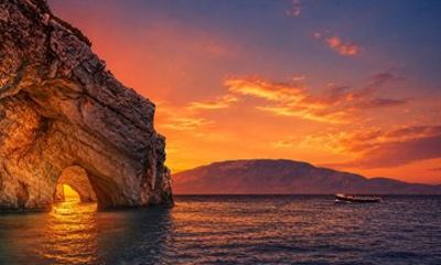 Zakynthos Sunset Boat Tour to Blue Caves, Swim Stops and Aperitif