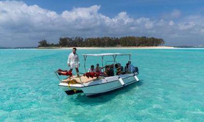 Mnemba Island Luxury Boat Tour with Dolphins and Snorkeling
