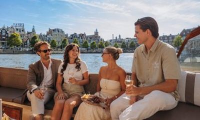 Amsterdam 1H Premium Canal Cruise with Snacks and Optional Drinks