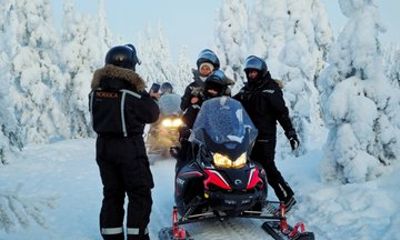 Private Snowmobile and Lappish Meal by the Fire