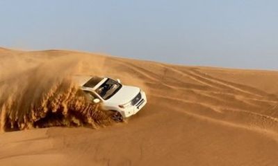 Desert Safari Dubai with Quad Bike, Camel Ride and BBQ Dinner
